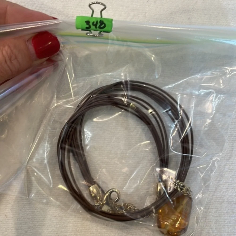 Lia Sophia Buona Sera amber pendant brown leather cord necklace